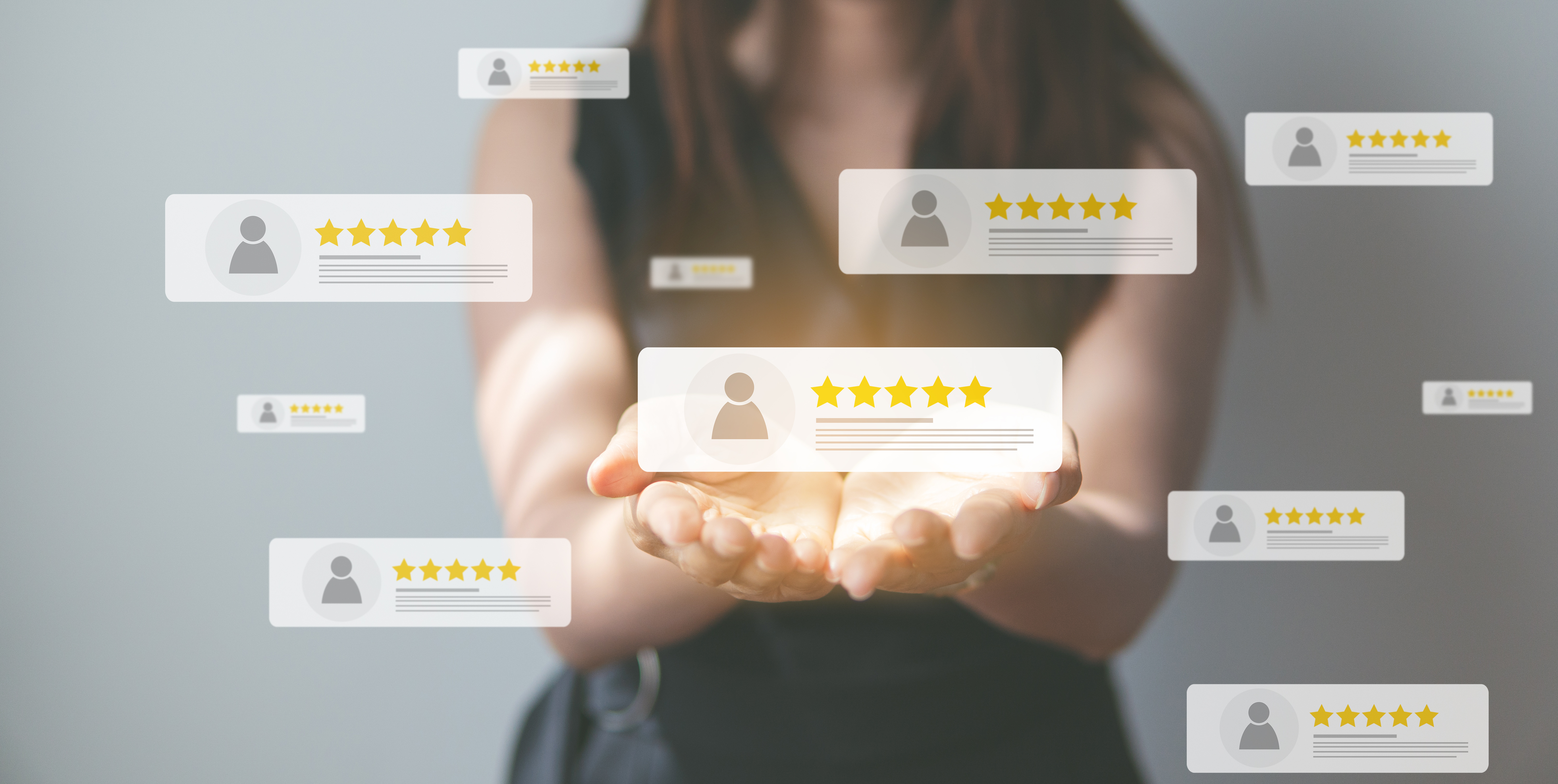 A person holds out their hands, surrounded by floating five-star customer reviews with profile icons.