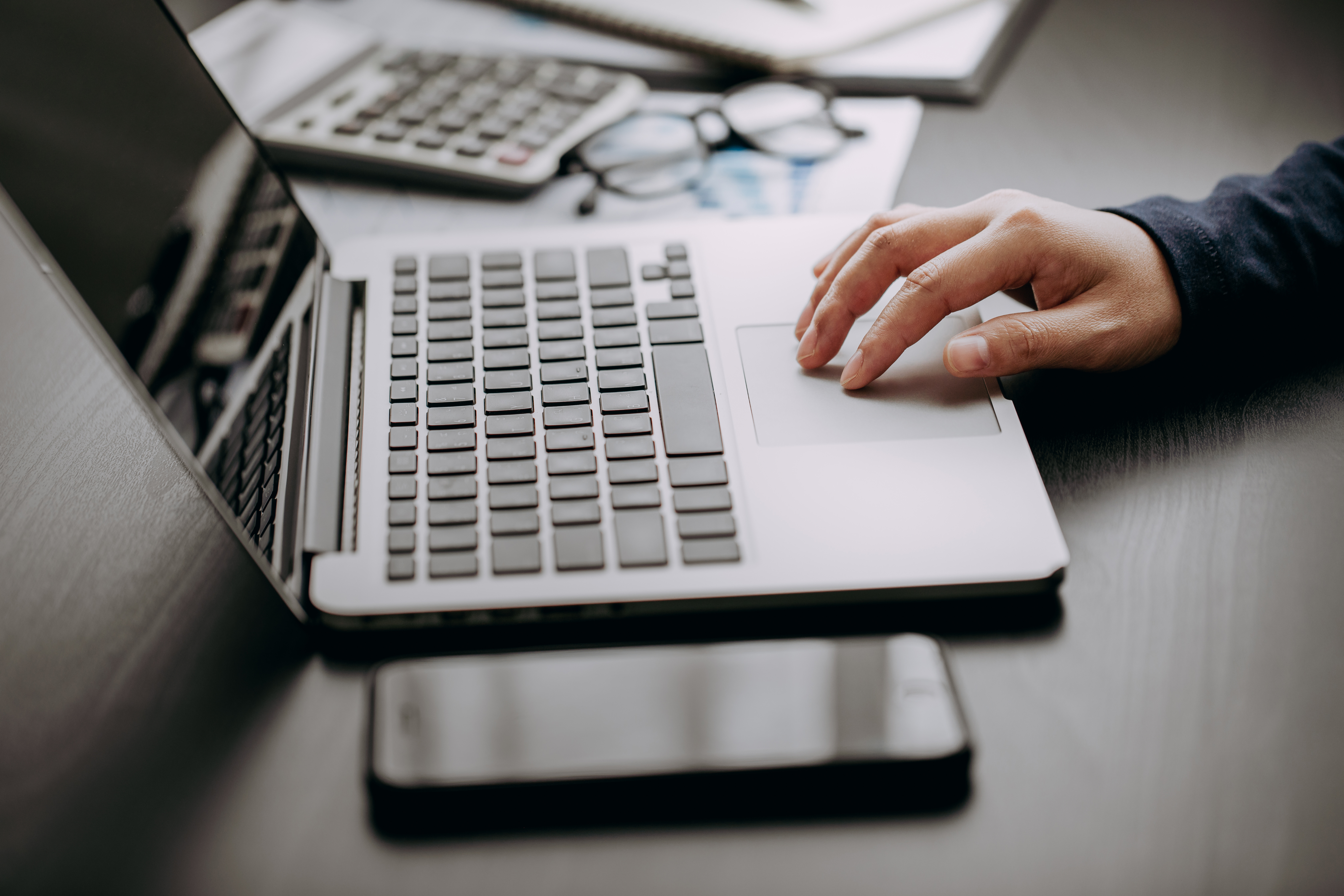 Typing on laptop image
