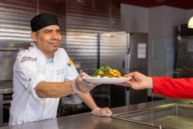 chef handing the food